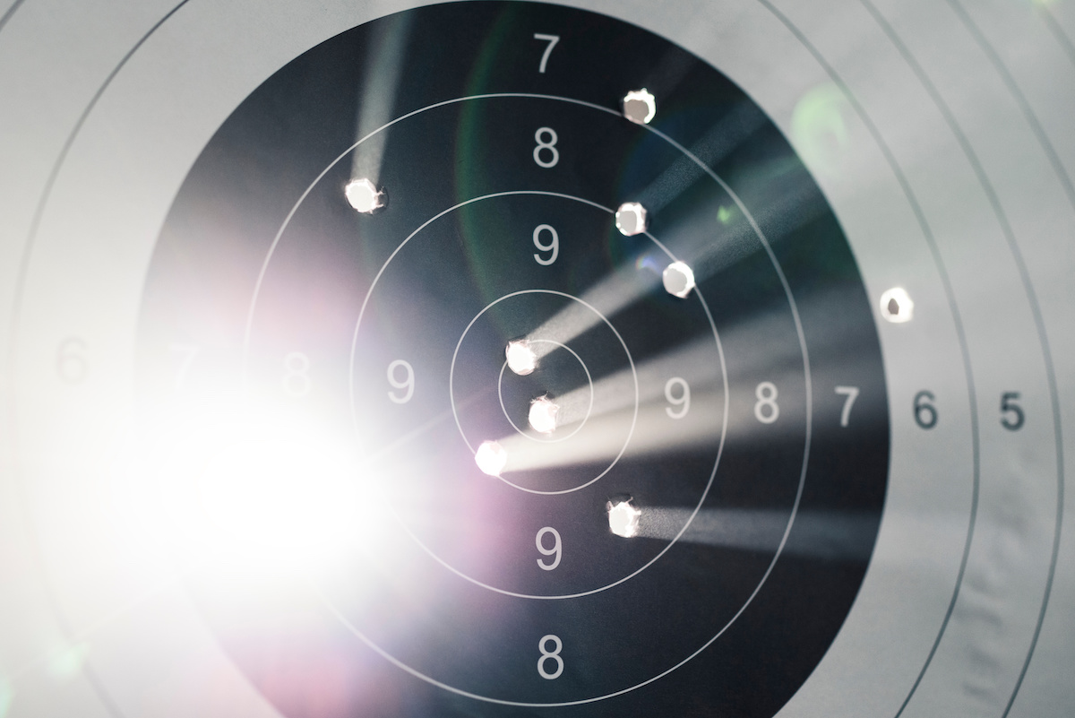 Shooting target with light coming out of holes